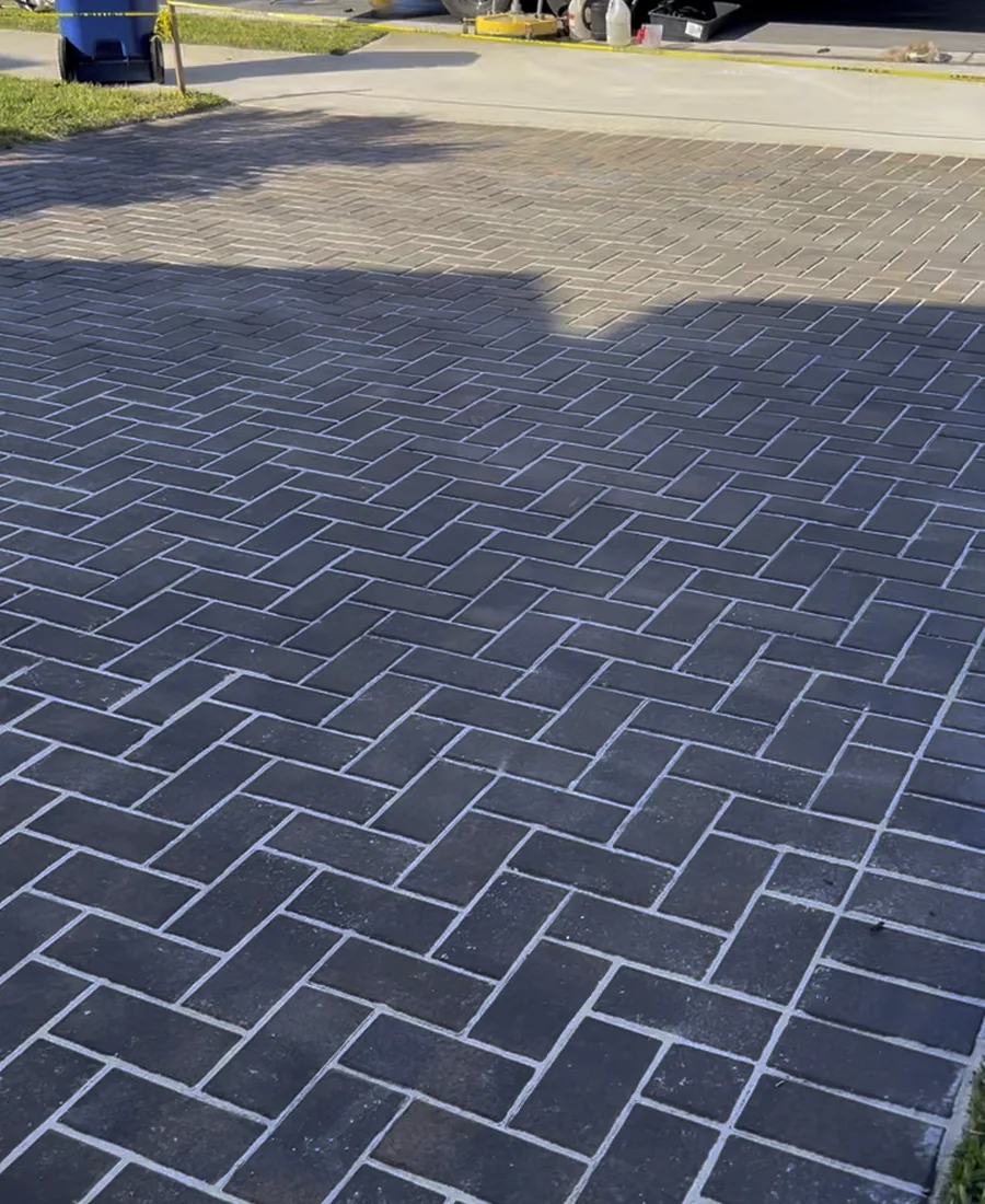 Deep charcoal pavers after professional cleaning and sealing