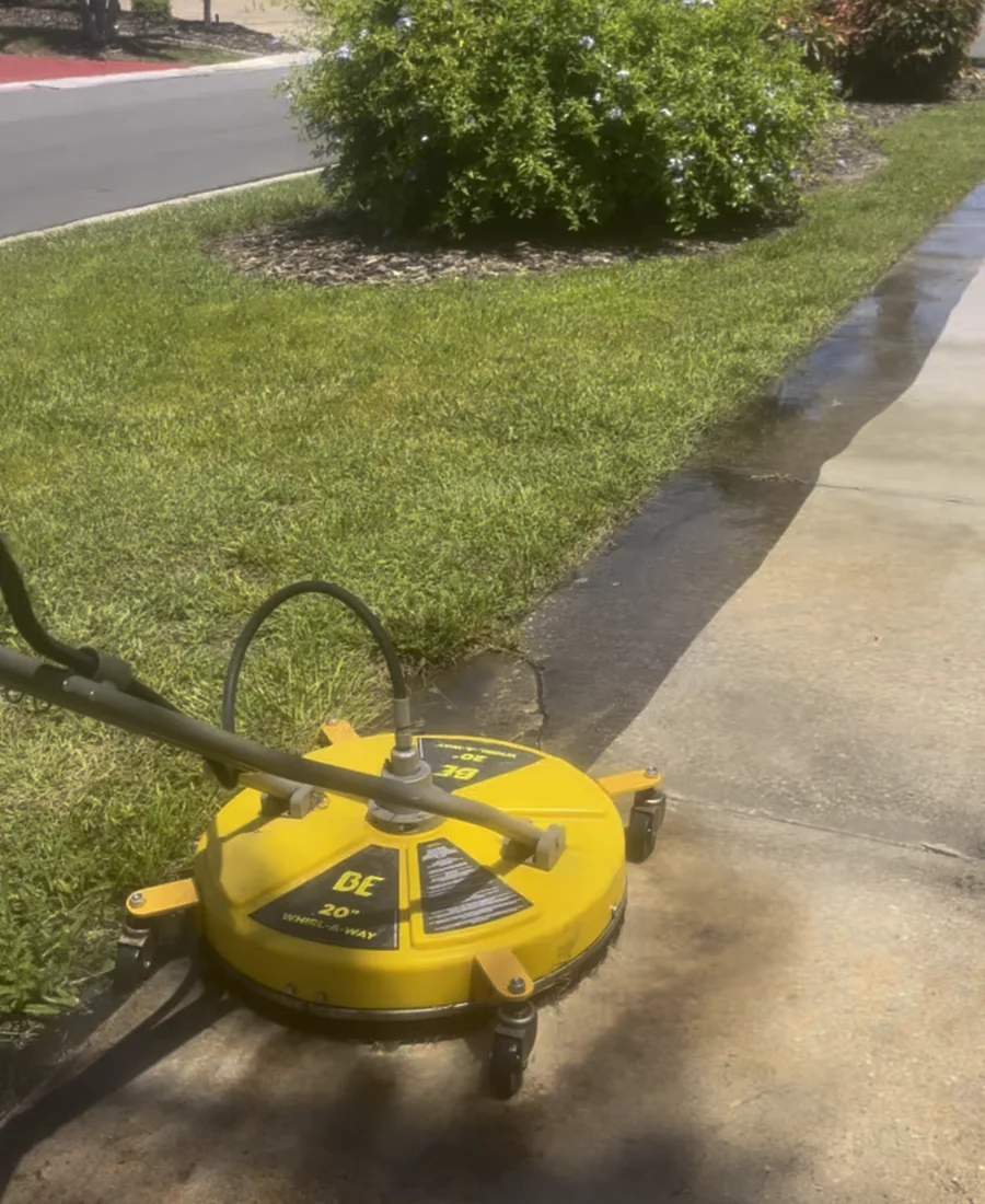 Surface cleaner restoring a concrete walkway